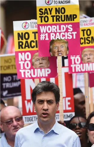  ??  ?? Demo: Ed Miliband joins placard-waving protesters in London yesterday