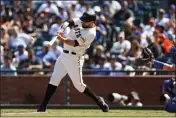  ?? SHAE HAMMOND — BAY AREA NEWS GROUP ?? San Francisco Giants' Brandon Belt (9) hits a double against Los Angeles Dodgers' Craig Kimbrel (46) in the ninth inning at Oracle Park in San Francisco on August 4, 2022.
