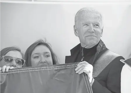  ??  ?? Former vice president Joe Biden poses for a photo with students after speaking at the March for Our Lives protest at Rodney Square in Wilmington, Del. JASON MINTO/DELAWARE NEWS JOURNAL