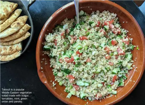  ??  ?? Tabouli is a popular Middle Eastern vegetarian salad made with bulgur, tomatoes, mint, green onion and parsley.