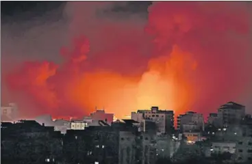  ?? AFP ?? Smoke billows from a fire following Israeli airstrikes on multiple targets in Gaza City early on Sunday.