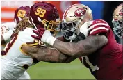  ?? ROSS D. FRANKLIN — THE ASSOCIATED PRESS, FILE ?? Washington Football Team defensive end Chase Young (99) and 49ers offensive tackle Trent Williams battle during the first half on Dec. 13 in Glendale, Ariz.