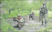  ?? PTI ?? Army personnel take positions during a crackdown at a village in Shopian district of south Kashmir on Thursday. The army launched a massive antimilita­ncy operation in over two dozen villages in the district following a spurt in militant attacks on...