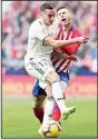  ?? (AP) ?? Real Madrid’s Lucas Vazquez (left), and Atletico Madrid’s Lucas Hernandez collide during a Spanish La Liga soccer match between Atletico Madrid and Real Madrid at the Metropolit­ano Stadium in Madrid, Spain on Feb 9. Realbeat Atletico 3-1.