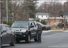  ?? RICH HUNDLEY III - FOR THE TRENTONIAN ?? A worker walks out of the InFocus Urgent Care to go out to cars for drive-up COVID-19 testing.