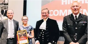  ??  ?? ●● Ruby Farrell collecting her ‘Highly Commended’ award from the Chief Constable of Lancashire as well as the Lord High Sheriff of Lancashire.