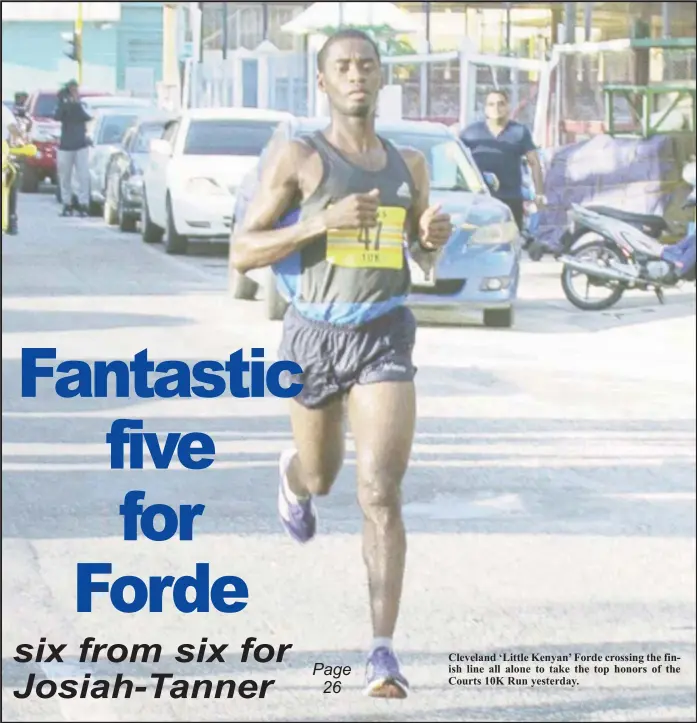  ??  ?? Cleveland ‘Little Kenyan’ Forde crossing the finish line all alone to take the top honors of the Courts 10K Run yesterday.