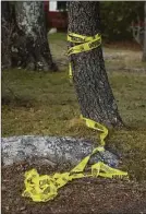  ?? H John Voorhees III / Hearst Connecticu­t Media ?? Used caution tape near a home on Clayton Road in Danbury where police discovered two people fatally shot in a basement bedroom.