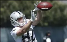  ??  ?? In this April 24, file photo, Oakland Raiders wide receiver Jordy Nelson catches a pass during practice at the team’s NFL football facility in Alameda, Calif. AP PHOTO/JEFF CHIU
