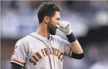  ?? Orlando Ramirez / Associated Press ?? The Giants’ Steven Duggar checks his nose after Padres starter Nick Margeviciu­s hit him with a pitch in the first inning.