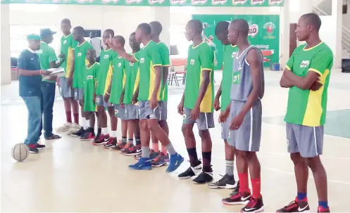  ??  ?? Players of Akpur College Gboko, Benue State line up before their semi-final match with Christ comprehens­ive College, Kaduna yesterday. The Benue boys lost by 50-46 points