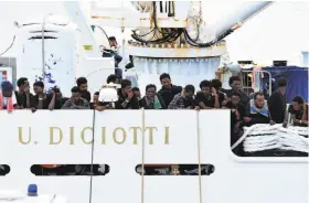  ?? Orietta Scardino / Associated Press ?? Migrants aboard the Italian coast guard ship Diciotti have waited for nine days for authoritie­s to allow them to disembark in the Sicilian port of Catania.