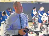  ?? GARY MIDDENDORF/DAILY SOUTHTOWN ?? Sean Airola, division chair for P.E. and driver’ss education at Carl Sandburg, sets up a spin class on Oct. 16.