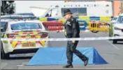  ?? REUTERS ?? A police officer is seen near the scene of the knife attacks in Birmingham, UK, on Sunday.