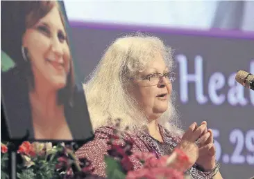  ?? [ANDREW SHURTLEFF/THE DAILY PROGRESS VIA THE ASSOCIATED PRESS, POOL] ?? Susan Bro, mother of Heather Heyer, speaks during a memorial for her daughter Wednesday at the Paramount Theater in Charlottes­ville, Va. Heyer was killed Saturday, when a car rammed into a crowd of people protesting a white nationalis­t rally.