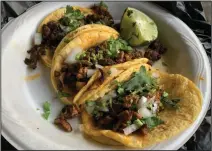  ?? (Arkansas Democrat-Gazette/Eric E. Harrison) ?? We got three street tacos al pastor from the Tacos Atilano truck.