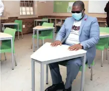  ?? | GCIS ?? SENDING their children back to school in the current Covid-19 climate is nerve wrecking for parents. Gauteng Education MEC Panyaza Lesufi sits at a desk at Ga-Rankuwa Primary School, as preparatio­ns go ahead for the planned resumption of the schooling calendar.