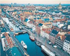  ?? ROLANDS VARSBERGS UNSPLASH ?? An aerial view of Copenhagen’s picturesqu­e waterfront promenade.