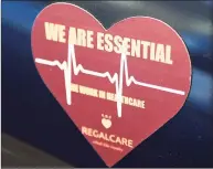  ?? Tyler Sizemore / Hearst Connecticu­t Media ?? A magnet is displayed on a car parked at RegalCare nursing and rehabilita­tion center in Greenwich Tuesday.