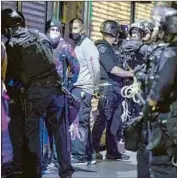  ?? Robert Gauthier Los Angeles Times ?? OFFICERS DETAIN dozens of people during a protest at Hollywood and Cahuenga boulevards June 1.