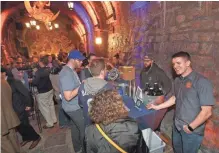  ?? JOHN KLEIN / FOR THE MILWAUKEE JOURNAL SENTINEL ?? People sample craft beer Tuesday at the Historic Miller Caves. The beer will be sold at a new bar at Miller Park this summer.