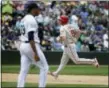  ?? TED S. WARREN — THE ASSOCIATED PRESS ?? Philadelph­ia Phillies’ Tommy Joseph, right, rounds the bases after hitting a solo home run off of Seattle Mariners pitcher Edwin Diaz, left, in the ninth inning of a baseball game, Wednesday in Seattle. The Phillies won 5-4.