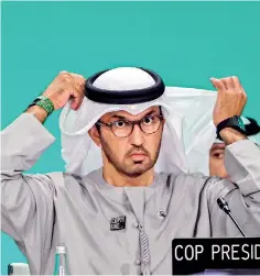  ?? ?? COP28 president Sultan Ahmed Al Jaber adjusts his ghutra, a traditiona­l headdress, during a plenary session during the United Nations climate summit in Dubai