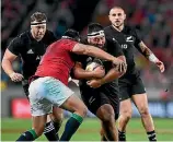  ?? PHOTOS: PHOTOSPORT­S/GETTY IMAGES ?? All Blacks prop Charlie Faumuina carries into contact, during the first test in Auckland.