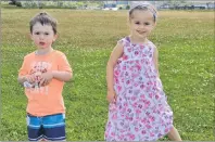  ?? NIKKI SULLIVAN/CAPE BRETON POST ?? Two-year -old Mark Phalen, left, and his four-year-old cousin, Inga Campbell, enjoy some time in Open Hearth Park with their moms on Monday. As of Monday, there are 600 students in Nova Scotia registered for preprimary program in Cape Breton schools. Students must be four years of age by Dec. 31, 2017, and living in the catchment area (boundaries) of the school holding the program to attend.