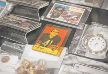  ?? ASHLEE REZIN/SUN-TIMES FILE ?? A 1969 Brian Piccolo football card was among an array of unclaimed property auctioned off last year during the Illinois State Fair.