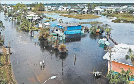  ?? JOE RAEDLE/GETTY ?? A drone shows the watery mess Thursday in Gulf Shores, Florida. One death in Alabama was blamed on Hurricane Sally.