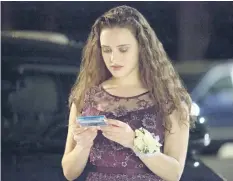  ?? BETH DUBBER/NETFLIX ?? Katherine Langford as Hannah Baker in a scene from the series, 13 Reasons Why. The popular TV series about Baker’s suicide that showed her ending her life may have prompted a surge in online searches for suicide, including how to do it, according to a...