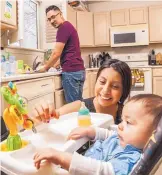  ?? COURTESY OF MARBLESTRE­ETSTUDIO.COM ?? Ricardo Mimbela, Claudia Saucedo and their son, Adriel, enjoy time together in the kitchen of their new home. The couple qualified for down-payment assistance, thanks to HomeLIFT.