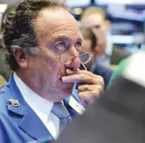  ?? —AP ?? NEW YORK: Trader Steven Kaplan works on the floor of the New York Stock Exchange.