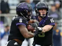  ?? AP Photo/ Richard W. Rodriguez ?? ■ TCU running back Darius Anderson (6) takes the handoff from quarterbac­k Max Duggan (15) in the first quarter against West Virginia on Friday in Fort Worth, Texas.