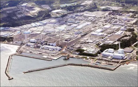  ?? ?? This aerial view shows the Fukushima Daiichi nuclear power plant in Fukushima, northern Japan on Aug 24, 2023, after its operator Tokyo Electric Power Company Holdings began releasing its first batch of treated radioactiv­e water into the Pacific Ocean. (AP)
