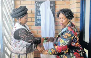  ?? Picture: ZIYANDA ZWENI ?? BRAND NEW BUILDING: Basic education minister Angie Motshekga, right, unveils the plaque at Dalibango Senior Primary on Friday in Mancu village with Port St Johns mayor Nomvuzo Mlombile-Cingo