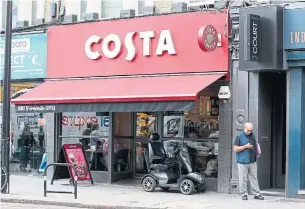  ?? NISHAT AHMED THE ASSOCIATED PRESS ?? Coca-Cola said Friday it will buy the Britain's biggest coffee company, Costa, from Whitbread for 3.9 billion pounds ($5.1 billion U.S.) in cash.