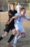  ?? Scott Herpst ?? LaFayette’s Austin Deering (left) gets tangled up with Ringgold’s Alex Palmer during the Ramblers’ Region 6-AAA finale last Monday night. LaFayette got the victory, 3-1.