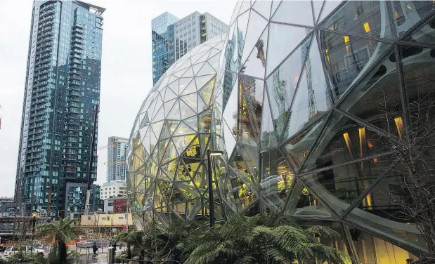  ?? MIKE KANE / BLOOMBERG ?? Amazon.com Inc.’s Seattle campus has injected $38 billion to the city’s economy from 2010 to 2016, the company says, but has incurred costs in the way of affordabil­ity, which HQ2 hopefuls such as Toronto would be wise to keep in mind.