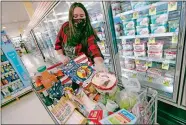  ?? KATHY WILLENS/AP PHOTO ?? Alexandra Lopez-Djurovic shops at an Acme market in Bronxville, N.Y.