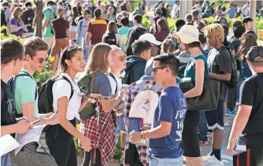  ?? DAVID WALLACE/THE REPUBLIC ?? Arizona State University students wait in line to vote Tuesday at their Tempe campus.