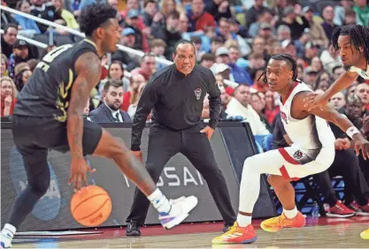  ?? GREGORY FISHER/USA TODAY SPORTS ?? North Carolina State head coach Kevin Keatts watches a play against Oakland on March 23 in the second round of the 2024 NCAA Tournament at PPG Paints Arena in Pittsburgh.