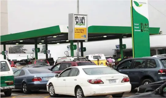  ??  ?? Cars on queue, waiting for fuel at a filling station