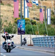  ?? AP/ARIEL SCHALIT ?? Members of the Samson Riders, an Israeli motorcycle club, cruise Sunday on a road leading to the new U.S. Embassy in Jerusalem after riding from the older embassy in Tel Aviv. The new embassy is to formally open today.