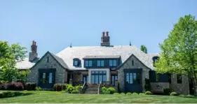  ?? Lucy Schaly/Post-Gazette ?? This home on Fairview Road in Fox Chapel sold for $6.3 million in April, a record price for Fox Chapel. The buyer —- a trust controlled by Duolingo CEO Luis von Ahn -— is now trying to sell it.