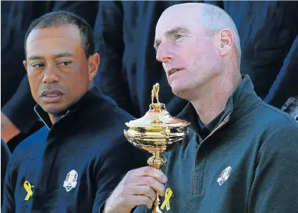  ?? Picture: FRANCK FIFE/AFP ?? CAN’T TOUCH THIS: Superstar Tiger Woods watches US team captain Jim Furyk hold The Ryder Cup as they pose for a team photograph ahead of the 42nd Ryder Cup at Le Golf National Course at Saint-Quentinen-Yvelines, southwest of Paris, on Wednesday