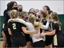  ?? DAN FENNER — MEDIANEWS GROUP, FILE ?? The Auburn Hills Oakland Christian volleyball team celebrates following its Division 4 regional championsh­ip win last Thursday.
The Lancers were scheduled to face Ubly in a state quarterfin­al on Tuesday, but now will be waiting at least three weeks for that match.