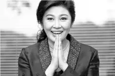  ??  ?? Yingluck Shinawatra greets supporters in this file photo. — Reuters photo