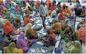  ??  ?? riGhT The langar in the Golden Temple serves an average of 50,000 free meals daily. All the food is donated and most of the helpers are volunteers who come together regardless of gender or class. opposiTe paGe The body of water that surrounds it is a sacred pool that the Golden Temple believed to have healing properties and bring material and spiritual benefits to devotees who bathe in it.